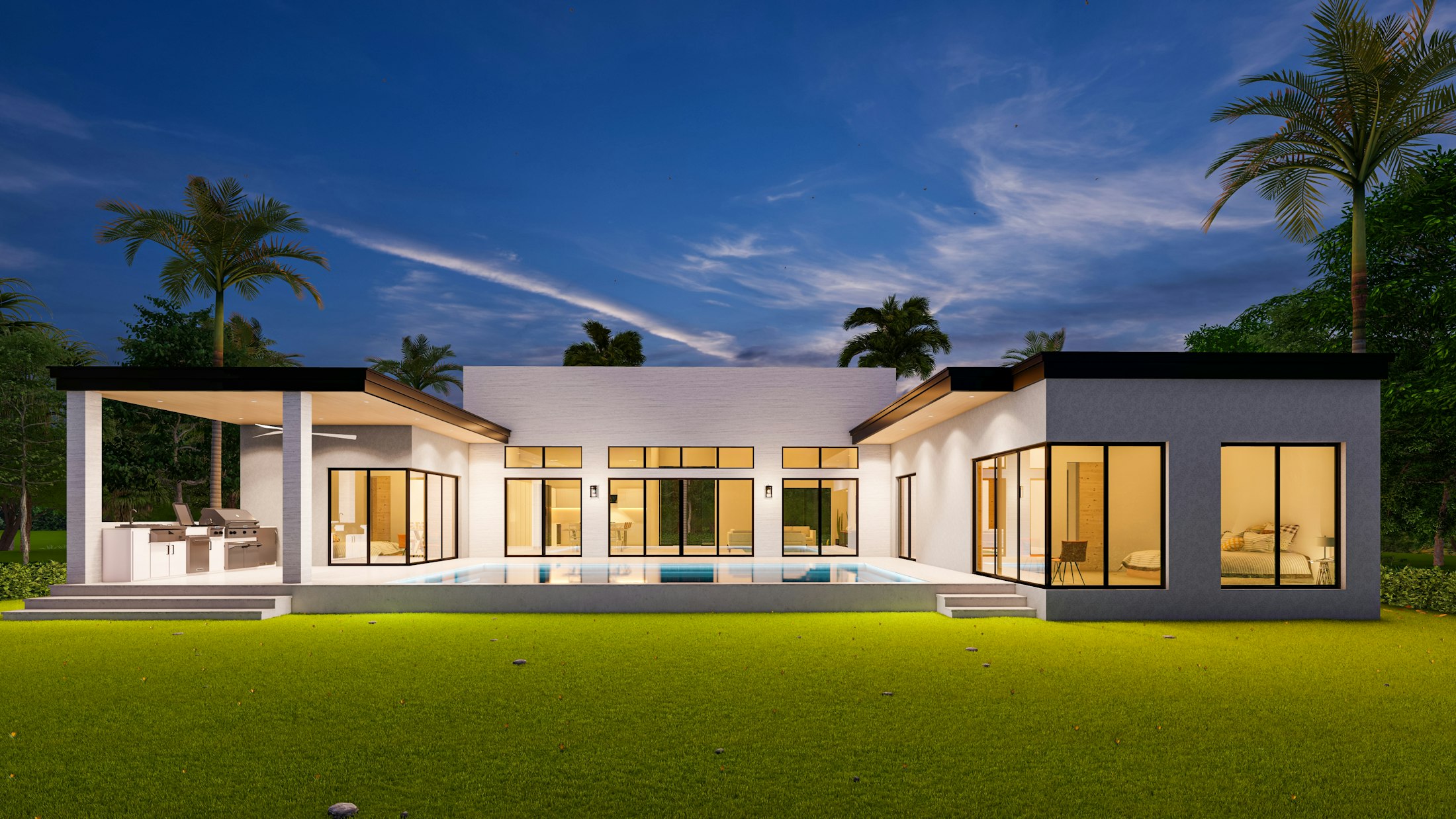 Casa Mirador al anochecer: un volumen largo y bajo con el nivel de sala iluminado por dentro